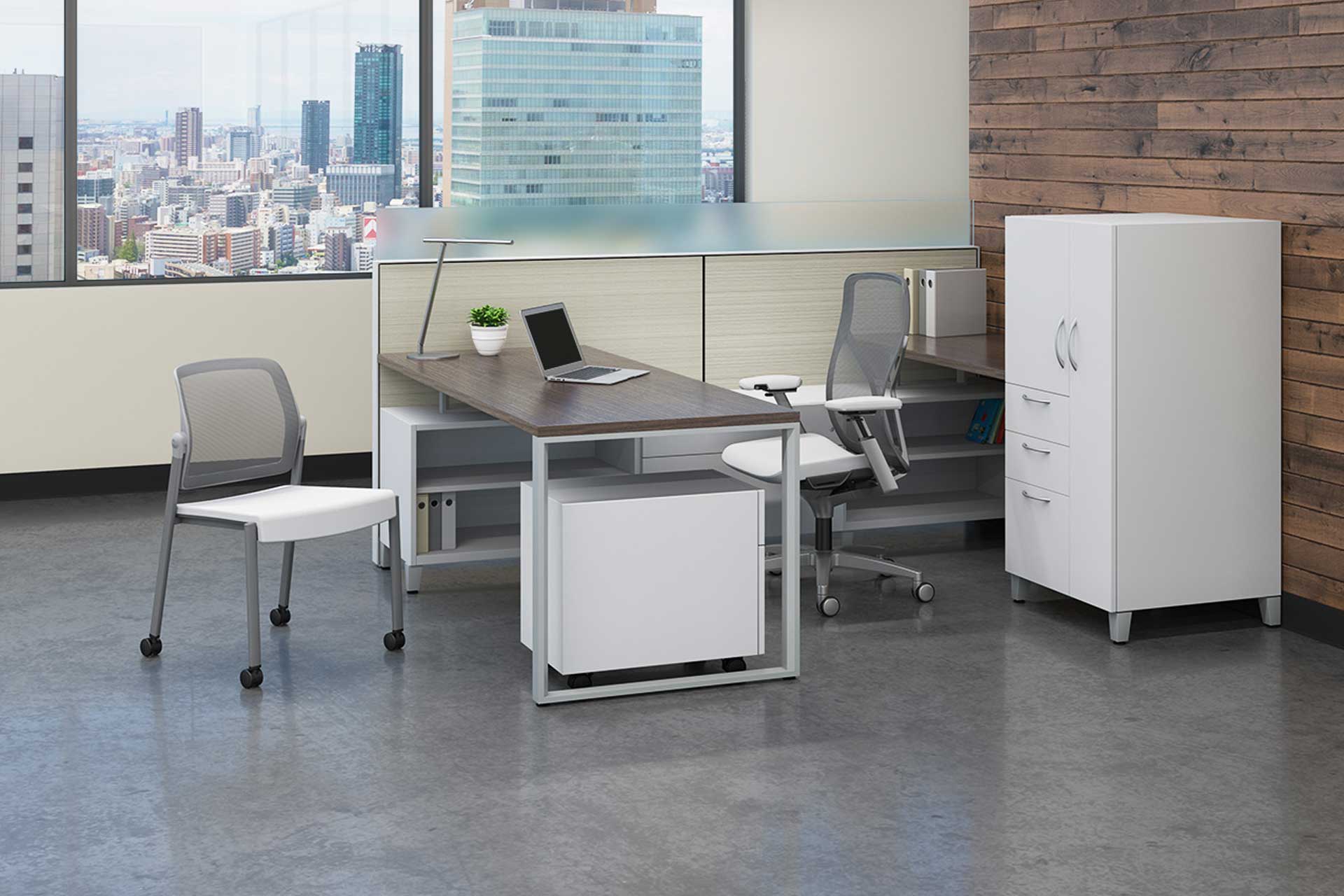 Modern office furniture showing one table, two chairs, a cabinet, and laptop in front of wide windows