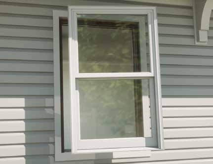 Pella double hung window pane being installed in a home